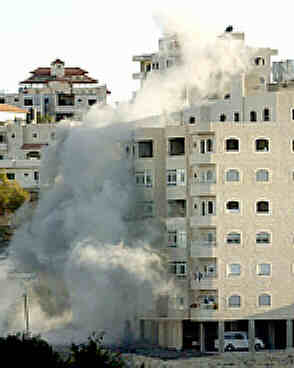 building shot by Israeli tank